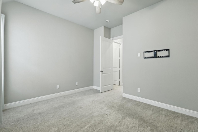 unfurnished bedroom featuring carpet flooring, baseboards, and ceiling fan
