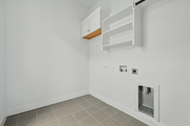 laundry area featuring electric dryer hookup, washer hookup, baseboards, hookup for a gas dryer, and cabinet space