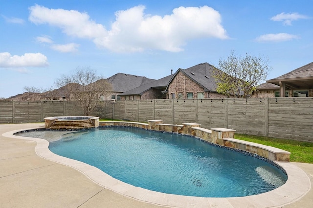 view of pool featuring a fenced backyard and a pool with connected hot tub