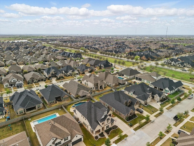 aerial view of property's location with nearby suburban area