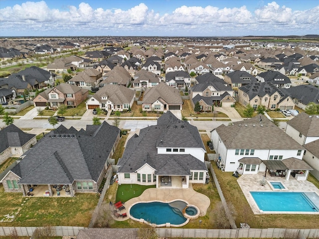 aerial view of residential area with a pool