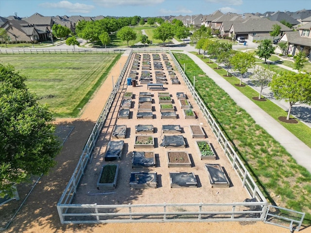 aerial view of property and surrounding area featuring nearby suburban area