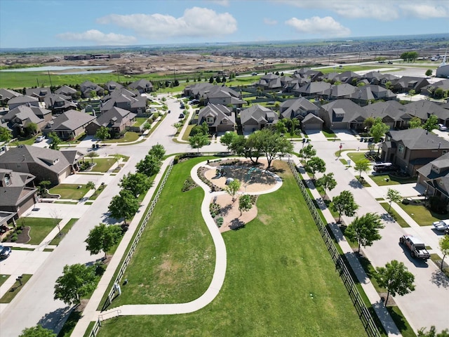 view of property location with nearby suburban area and a large body of water