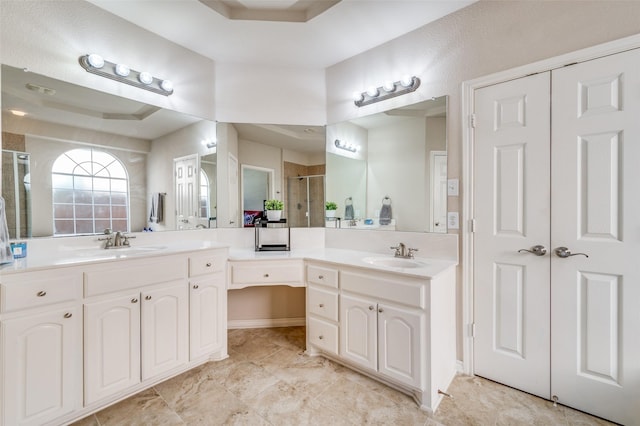 full bath with vanity, tile patterned flooring, a shower stall, and a raised ceiling