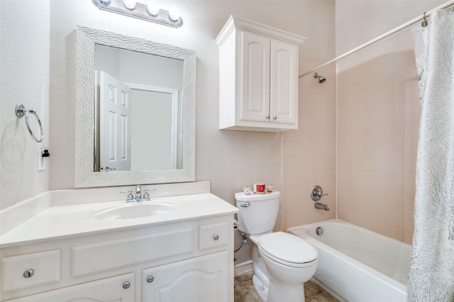 bathroom with toilet, vanity, and shower / bath combo with shower curtain