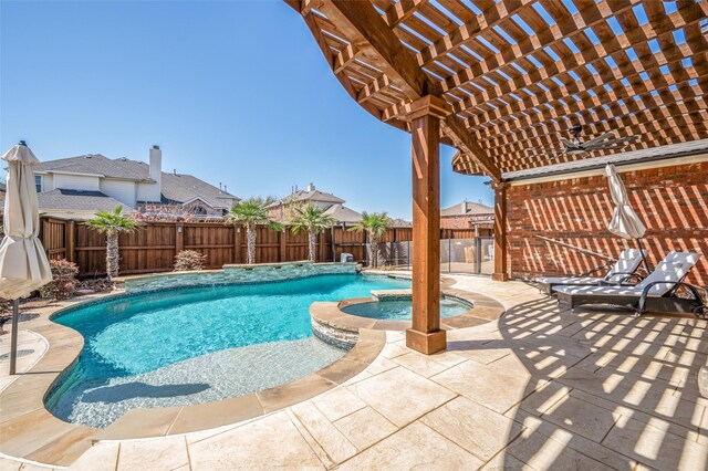 13951 Dutch Hollow Dr, Frisco, TX 75033 - view of pool with a fenced backyard, a pool with connected hot tub, a pergola, and a patio area