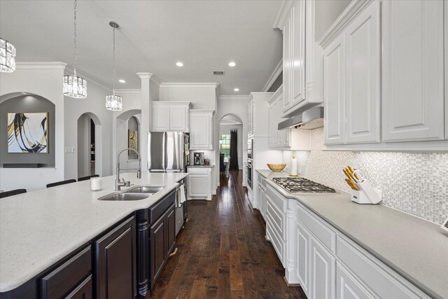 1904 Kings Pass, Heath, TX 75032 - kitchen featuring white cabinetry, stainless steel appliances, dark wood-style floors, and a sink