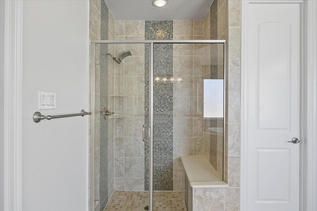 1904 Kings Pass, Heath, TX 75032 - bathroom featuring a garden tub, a shower stall, two vanities, and a sink
