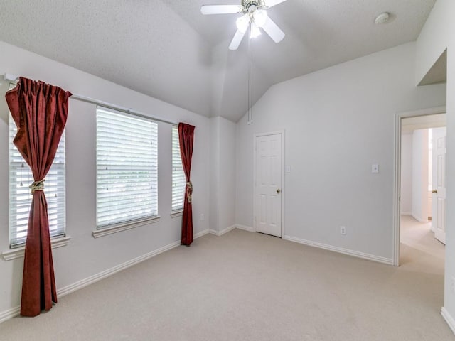 8317 Spring Valley Ln, Plano, TX 75025 - spare room featuring baseboards, light colored carpet, a ceiling fan, and vaulted ceiling
