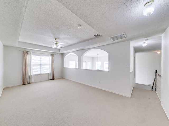 8317 Spring Valley Ln, Plano, TX 75025 - spare room featuring a ceiling fan, carpet, and visible vents