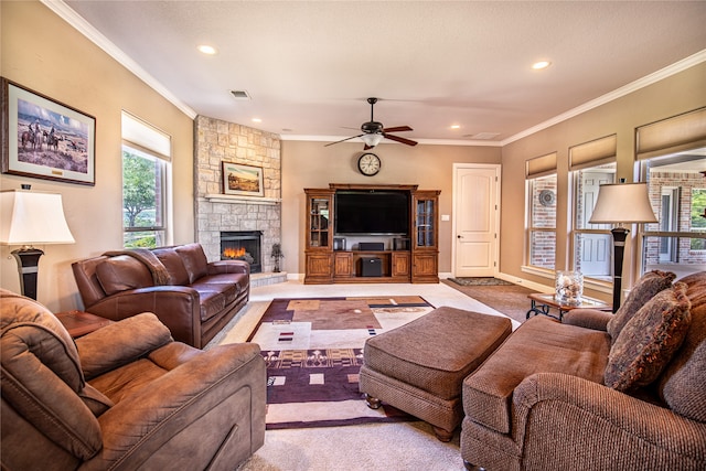carpeted living area with a fireplace, a ceiling fan, recessed lighting, ornamental molding, and baseboards