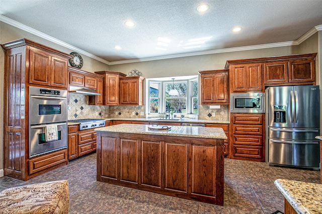 kitchen with appliances with stainless steel finishes, a center island, a sink, granite tiled floors, and light stone counters