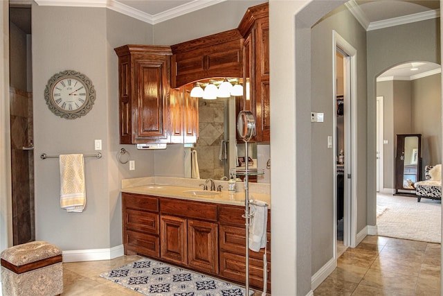 full bathroom featuring ornamental molding, baseboards, vanity, and tile patterned flooring