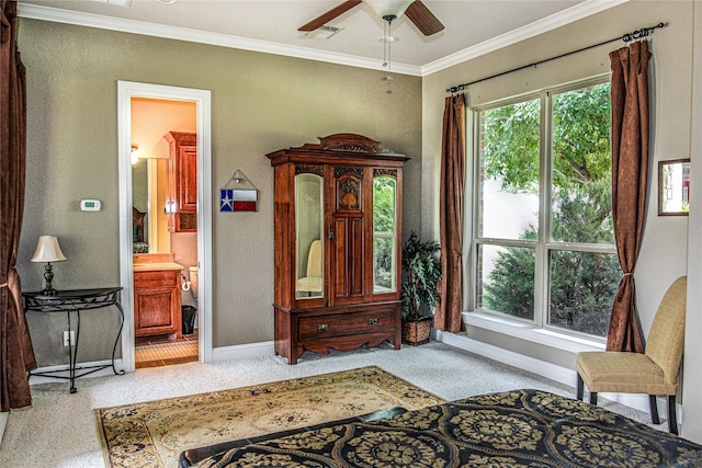sitting room featuring baseboards, carpet floors, ornamental molding, and ceiling fan