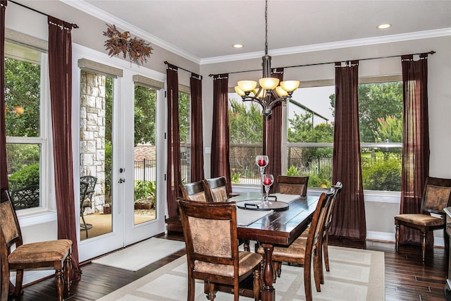 dining space with plenty of natural light, a chandelier, wood finished floors, ornamental molding, and recessed lighting