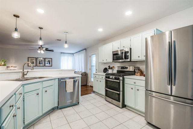 kitchen featuring pendant lighting, a sink, ceiling fan, stainless steel appliances, and visible vents