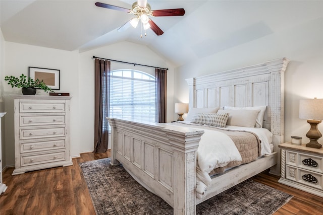 bedroom featuring dark wood-style floors, a ceiling fan, and vaulted ceiling