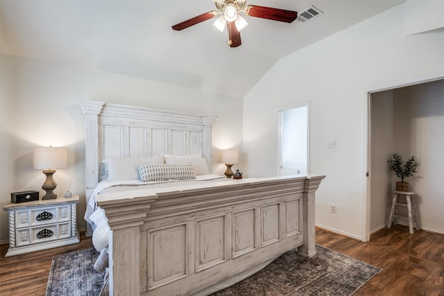 bedroom with dark wood-style flooring, a ceiling fan, visible vents, baseboards, and lofted ceiling