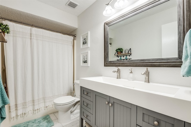 bathroom featuring vanity, tile patterned floors, toilet, visible vents, and shower / tub combo with curtain