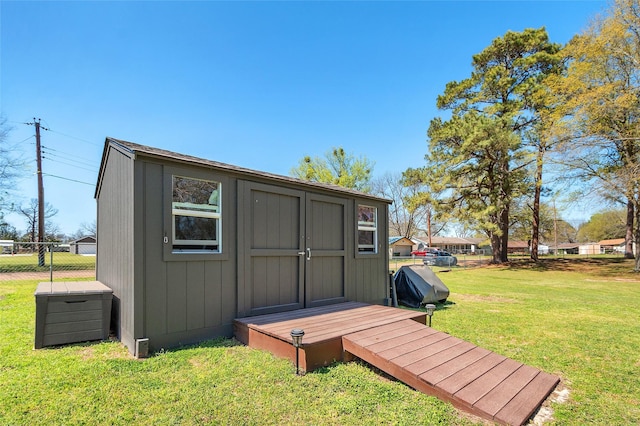 view of shed with fence