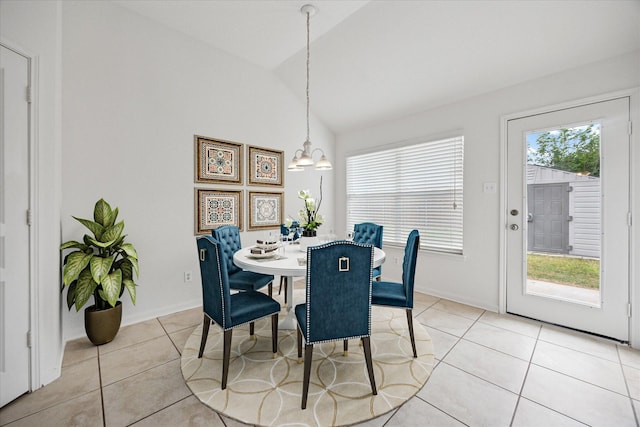 11709 Netleaf Ln, Fort Worth, TX 76244 - dining area featuring lofted ceiling, light tile patterned floors, a chandelier, and baseboards