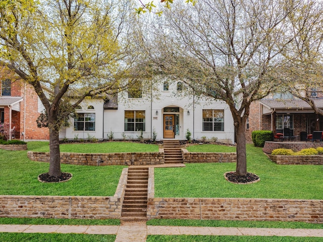 1381 Coastal Dr, Rockwall, TX 75087 - view of front of home featuring a front lawn and stucco siding