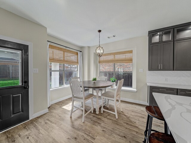 living area with crown molding, arched walkways, and visible vents