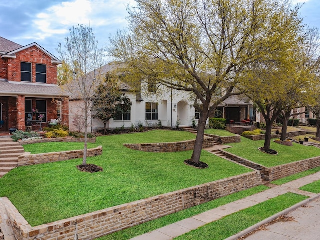 1381 Coastal Dr, Rockwall, TX 75087 - view of front facade with a front yard, a porch, and a shingled roof