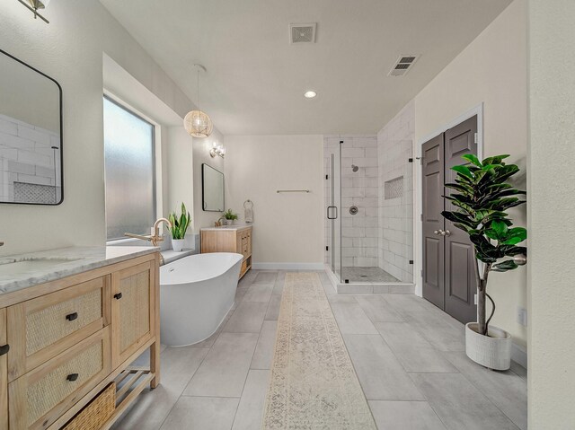 full bathroom with a shower stall, tile patterned flooring, and baseboards