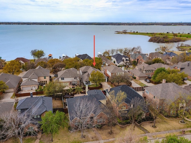 birds eye view of property featuring a residential view and a water view