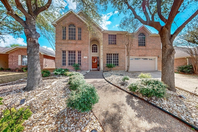 1312 Cattle Crossing Dr, Fort Worth, TX 76131 - traditional-style house featuring brick siding, concrete driveway, and an attached garage