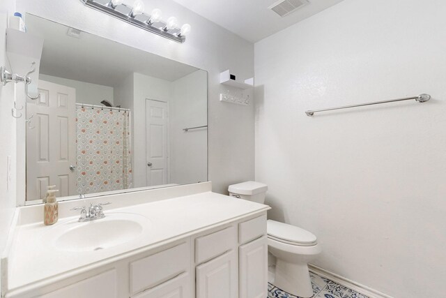 1312 Cattle Crossing Dr, Fort Worth, TX 76131 - bathroom with vanity, toilet, baseboards, a shower with curtain, and tile patterned flooring