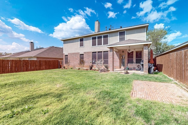 1312 Cattle Crossing Dr, Fort Worth, TX 76131 - rear view of house with brick siding, ceiling fan, a chimney, and a patio area