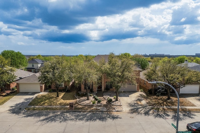 1312 Cattle Crossing Dr, Fort Worth, TX 76131 - obstructed view of property with driveway, a garage, and brick siding