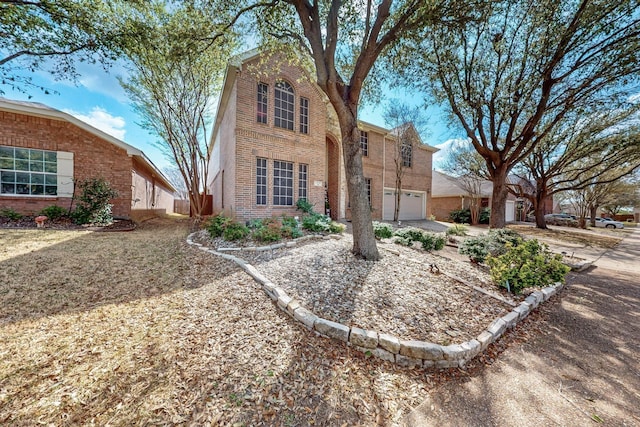 1312 Cattle Crossing Dr, Fort Worth, TX 76131 - traditional-style house featuring brick siding and an attached garage