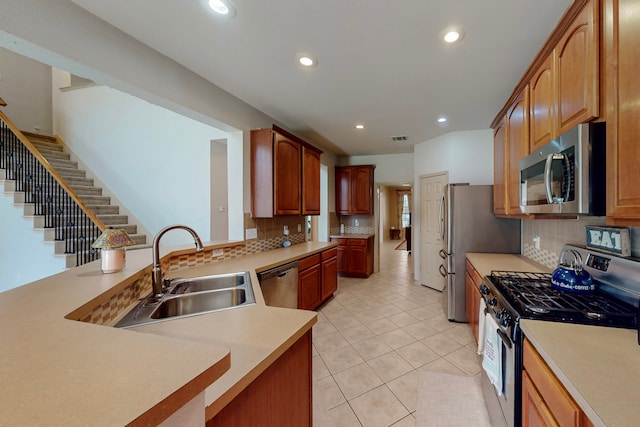 1312 Cattle Crossing Dr, Fort Worth, TX 76131 - kitchen with appliances with stainless steel finishes, a sink, backsplash, recessed lighting, and light countertops