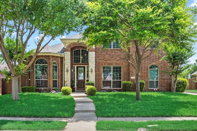 1192 Oak Hill Ln, Murphy, TX 75094 - traditional home featuring brick siding, stone siding, and roof with shingles