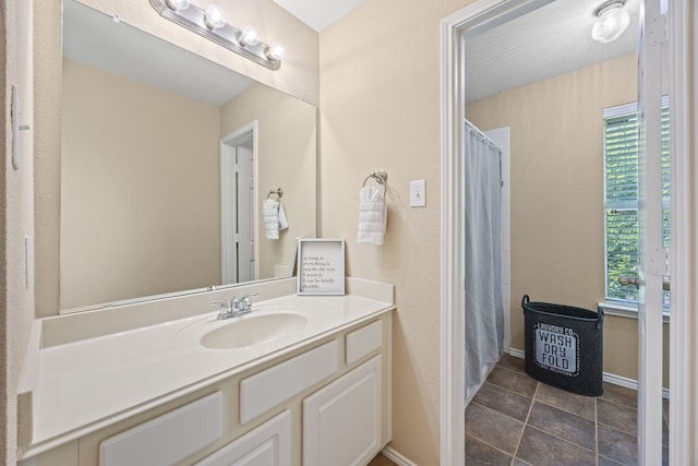 1192 Oak Hill Ln, Murphy, TX 75094 - full bath with vanity, healthy amount of natural light, tile patterned floors, and a shower with curtain