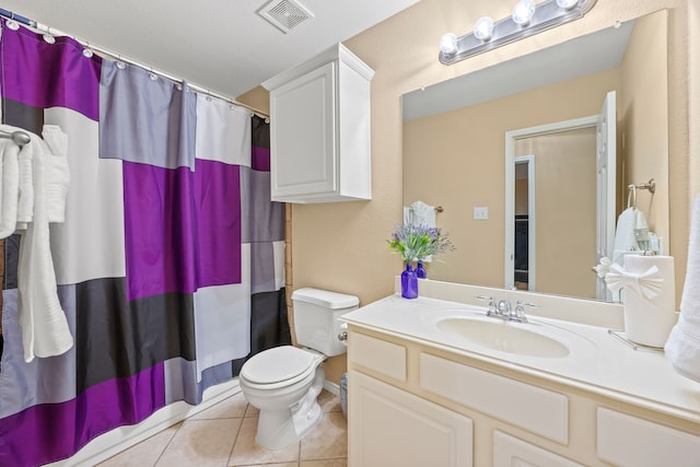 1192 Oak Hill Ln, Murphy, TX 75094 - bathroom with tile patterned flooring, toilet, vanity, and a shower with curtain