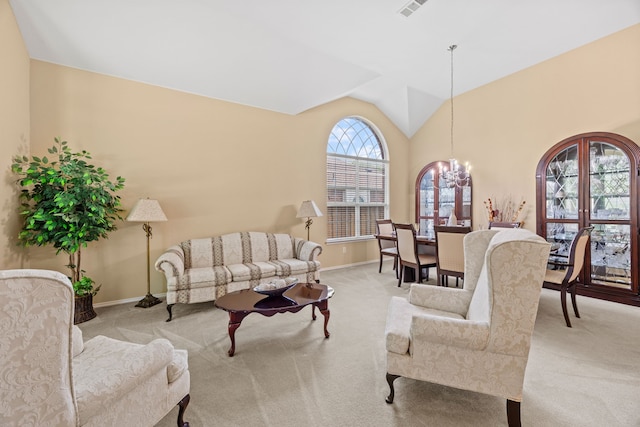 1192 Oak Hill Ln, Murphy, TX 75094 - carpeted living area featuring baseboards, lofted ceiling, and a chandelier