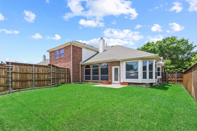 1192 Oak Hill Ln, Murphy, TX 75094 - back of house with brick siding, a chimney, a patio, and a shingled roof