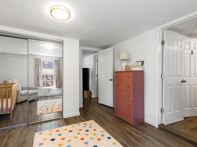 5536 Goodman Ave, Fort Worth, TX 76107 - bedroom with wood finished floors, a closet, and baseboards