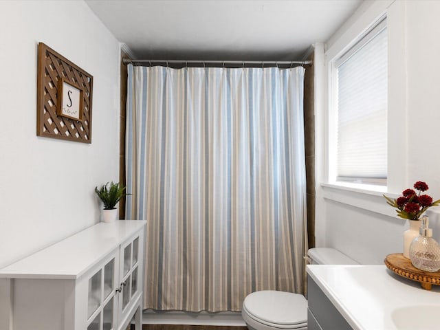 5536 Goodman Ave, Fort Worth, TX 76107 - bathroom featuring toilet, vanity, and a shower with curtain