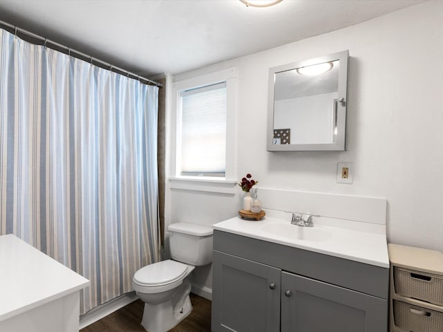 5536 Goodman Ave, Fort Worth, TX 76107 - bathroom featuring vanity, wood finished floors, toilet, and a shower with curtain