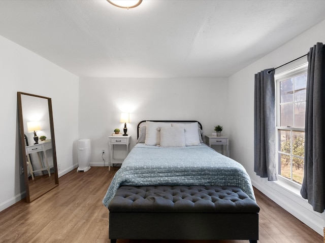5536 Goodman Ave, Fort Worth, TX 76107 - bedroom with light wood finished floors and baseboards