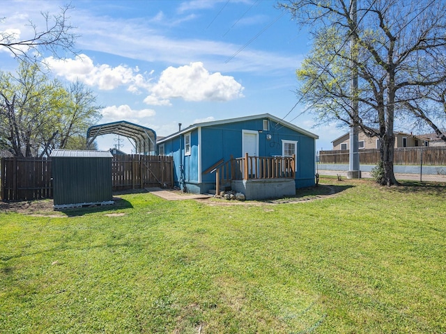 5536 Goodman Ave, Fort Worth, TX 76107 - back of property featuring a carport and a wooden deck