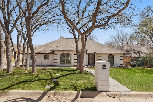 2107 Emerald Lake Dr, Arlington, TX 76013 - french country style house featuring a front lawn and brick siding