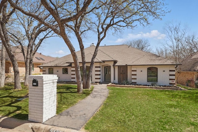 2107 Emerald Lake Dr, Arlington, TX 76013 - unfurnished bedroom with visible vents, light wood-style floors, a decorative wall, and a tray ceiling