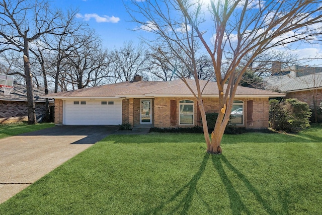 single story home featuring a garage, a chimney, concrete driveway, brick siding, and a front lawn