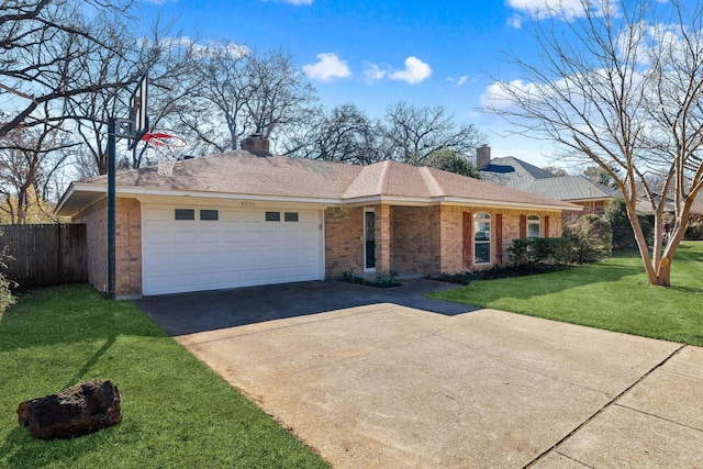 ranch-style home featuring a garage, brick siding, driveway, and a chimney
